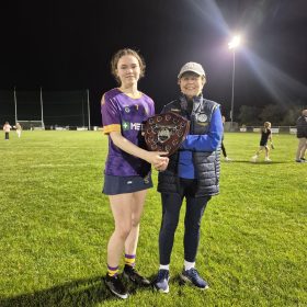 10th Sept 2026 Div 1B Camogie Champs Clara King accepts the Trophy